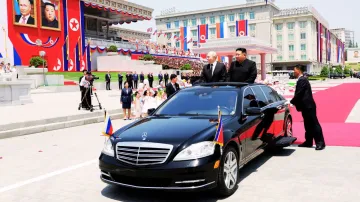 Russia's President Vladimir Putin and North Korea's leader Kim Jong Un attend an official welcoming 