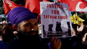 A Sikh demonstrator attends a protest called by the Italian trade union CGIL following the death of 