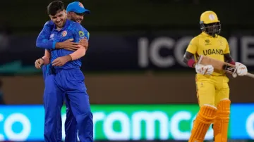 Fazalhaq Farooqi celebrates a wicket against Uganda.