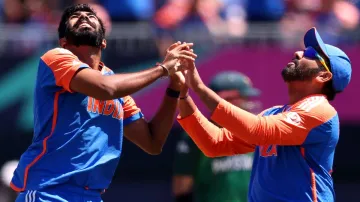 Jasprit Bumrah celebrates with Rohit Sharma.