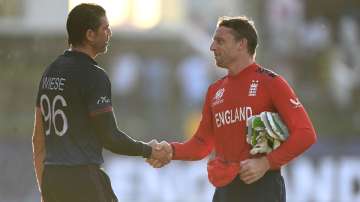 David Wiese shakes hands with Jos Buttler.