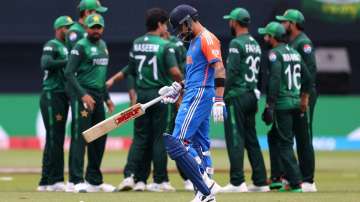 Virat Kohli walks back towards the dressing room after his dismissal against Pakistan