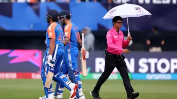 Virat Kohli and Rohit Sharma walk towards the dug out.