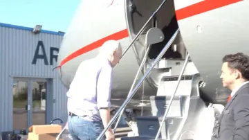 WikiLeaks founder Julian Assange boards a plane