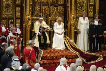 King Charles III addresses hundreds of lawmakers and scarlet-robed members of the House of Lords.