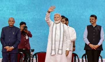 Prime Minister Narendra Modi waves to the crowd during an event in Mumbai