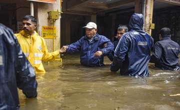 Locals being evacuated due to heavy waterlogging following incessant rains, in Pune district. The India Meteorological Department (IMD) has issued a red alert, forecasting continued downpours in the district. 