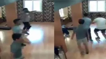 Snapshot from the viral video in which a man is seen falling on the floor of the gym