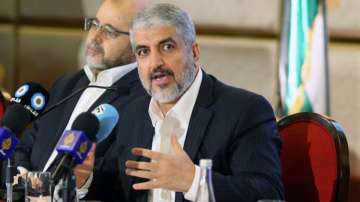 Hamas leader Khaled Meshaal gestures as he announces a new policy document in Doha, Qatar, May 1, 20