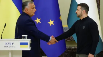 Hungary's Prime Minister Viktor Orban and Ukrainian President Volodymyr Zelenskyy shake hands after 