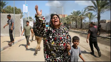 People react after an Israeli airstrike in Al-Mawasi, near Khan Younis in southern Gaza.