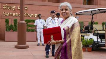 Union Finance Minister Nirmala Sitharaman with a red pouch carrying the Budget documents arrives at the Parliament to present the Union Budget 2024-25, in New Delhi.