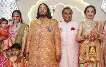 Reliance Industries Chairman Mukesh Ambani with wife Nita Ambani, son Anant Ambani, daughter-in-law Shloka Mehta Ambani and her children, poses for pictures upon their arrival for Anant and Radhika Merchants wedding, at Jio World Convention Centre, in Mumbai.