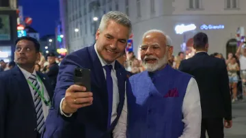 Austrian Chancellor clicking a selfie with Prime Minister Narendra Modi in Vienna.