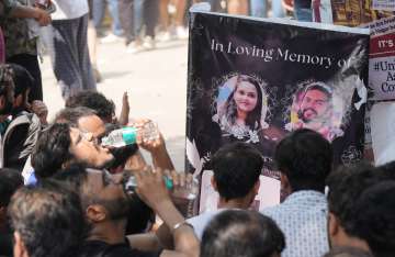 Students stage a protest after three civil services aspirants died due to drowning at a coaching centre in Old Rajinder Nagar area