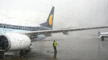 A plane stationed at the airport during rains in Mumbai