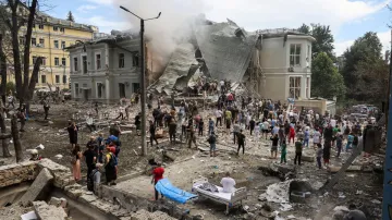 Rescuers work at Ohmatdyt Children's Hospital that was damaged during a Russian missile strikes