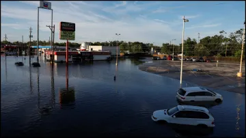 Cars and buildings are partially submerged in floodwaters in the aftermath of Hurricane Beryl.