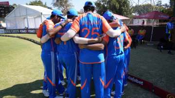 Team India in a huddle.