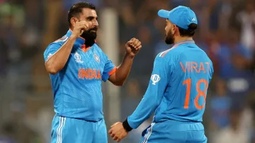 Mohammed Shami celebrates a wicket with Virat Kohli.