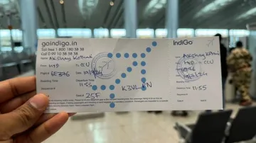 A hand-written boarding pass at Hyderabad Airport