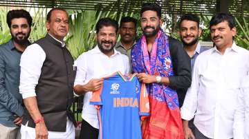 Mohammed Siraj presents India's T20 World Cup jersey to Telangana CM Revanth Reddy.