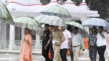 Uttar Pradesh Chief Minister Yogi Adityanath visits the Gorakhnath temple, amid rain, in Gorakhpur,.