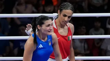 Algeria's Imane Khelif offers a bit of support for Ilaty's Angela Carini, who couldn't stop her tears after abandoning her bout in just 46 seconds