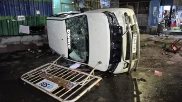 A vandalised Kolkata Police vehicle is seen amid protest at the RG Kar Medical College and Hospital against the alleged rape and murder of a trainee doctor inside the hospital premises in Kolkata