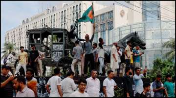 People celebrate the resignation of Prime Minister Sheikh Hasina in Dhaka, Bangladesh.