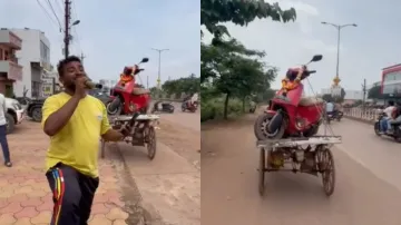 Man singing ‘Tadap Tadap’ in front of an Ola showroom