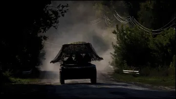 A Ukrainian armoured military vehicle travels near the Russian-Ukrainian border.