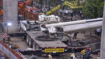 Gujarat news, Crane falls onto building during metro construction work in Surat, rescue operation, s