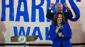 US Democratic vice presidential candidate Minnesota Governor Tim Walz cheers Democratic presidential