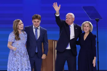 U.S. Democratic vice presidential nominee Minnesota Governor Tim Walz stands next to his wife Gwen, 