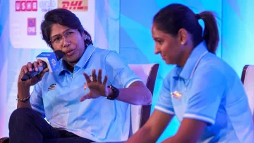 Jhulan Goswami and Harmanpreet Kaur addressing the press at an event.