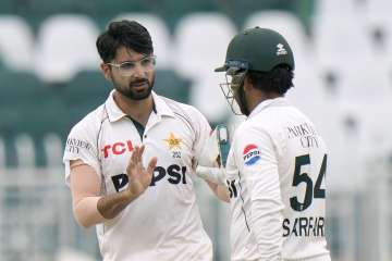 Abrar Ahmed having a word with Sarfaraz Ahmed.