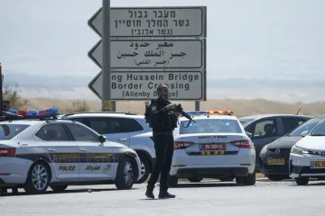 Israeli police stand guard near the site of a deadly shooting attack where Israeli officials say thr