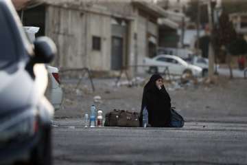 Lebanese woman sitting outside a shelter home