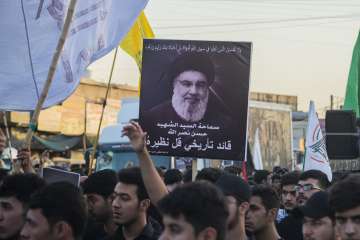 Hezbollah supporters with a poster of Hassan Nasrallah