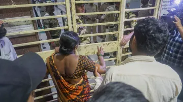 Parents of Akshay Shinde, the accused in the Badlapur sexual assault case of two minor girls, outside the Kalwa Hospital where his body was brought after the police encounter