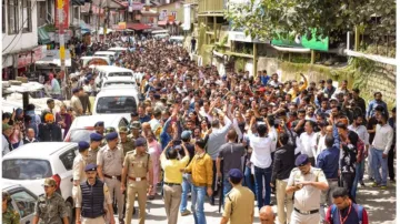 People raise slogans during a protest against the alleged illegal construction of a mosque in Shimla.  