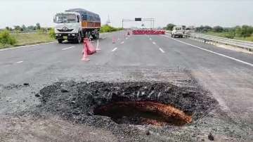 A big crater is developed after a part of road caves in