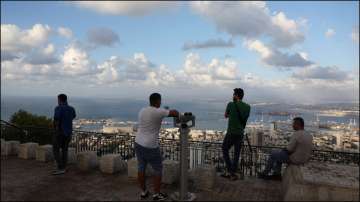 People look over the city of Haifa amid cross-border hostilities between Hezbollah and Israel.