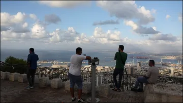 People look over the city of Haifa amid cross-border hostilities between Hezbollah and Israel.