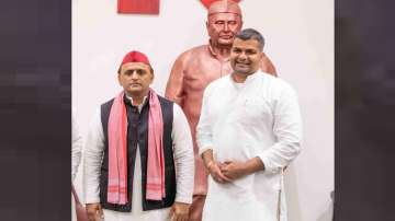 SP chief Akhilesh Yadav with party leader Arjun Arya