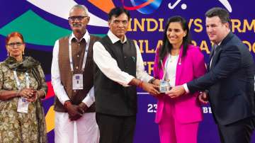 Sports Minister Mansukh Mandaviya with Rani Rampal.