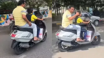 Little girl riding scooter