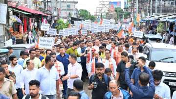 Minister Pijush Hazarika participates in a large protest rally in Jagiroad against the anti-Assam stance of Congress leaders.