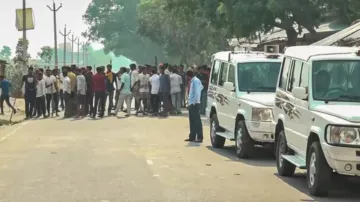 People block a road following Sunday night violence during goddess Durga idol immersion.